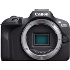 Canon EOS R100 mirrorless camera side view with RF-S 18-45mm lens on white background