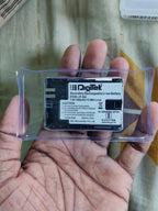 Digitek LP-E6 1800mAh camera battery in clear protective case showing model label