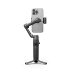 DJI Osmo Mobile 8 gimbal side view holding smartphone on built-in tripod