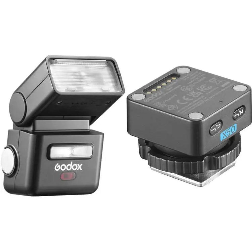 Godox iT32 flash with tilted diffuser beside detached turquoise X5O trigger for Olympus and Panasonic