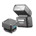Godox iT32 flash and X5O Olympus Panasonic wireless trigger front three-quarter view