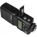 Godox TT350F rear controls and open two-AA battery compartment