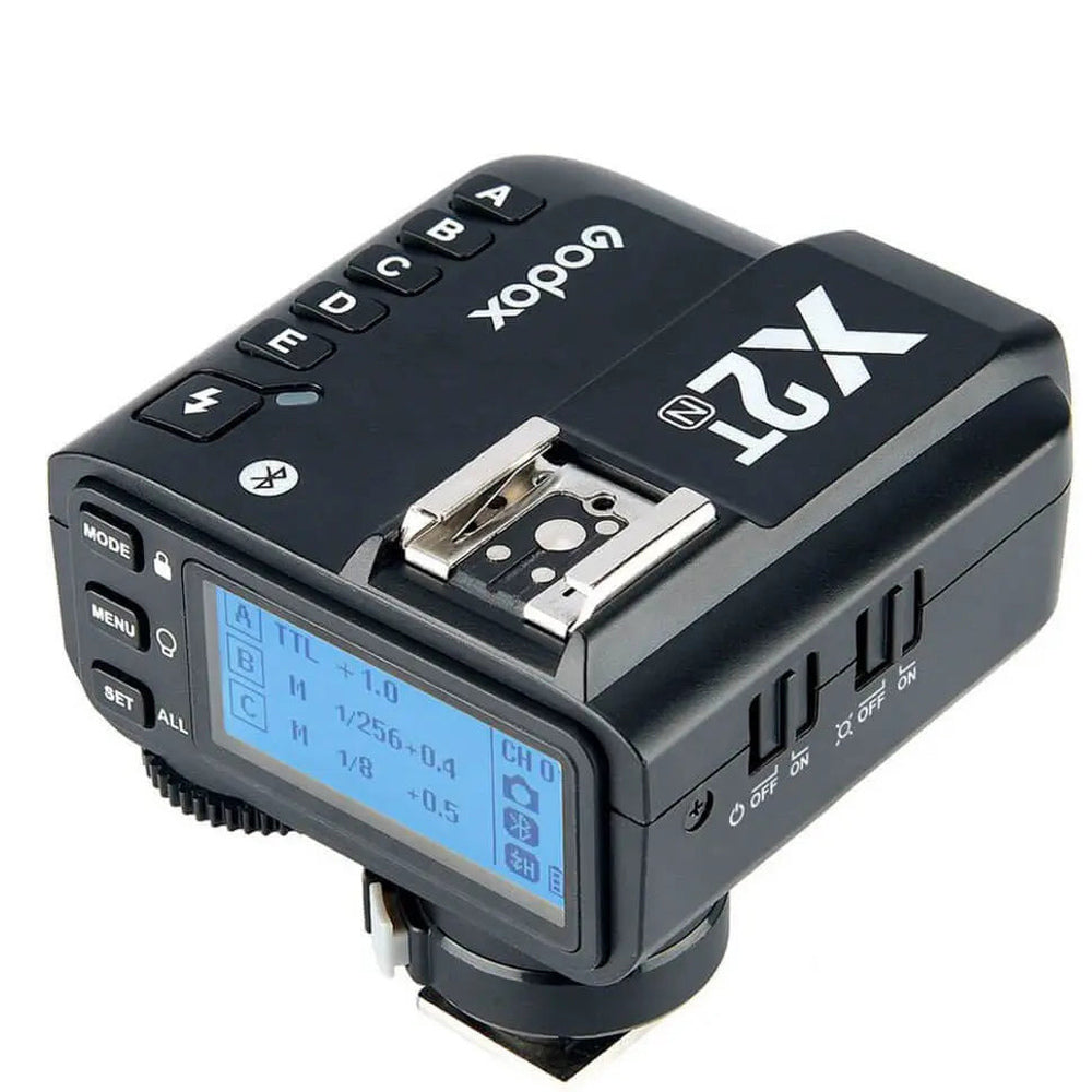 Godox X2T-N Nikon TTL wireless trigger three-quarter view showing LCD group buttons and hotshoe