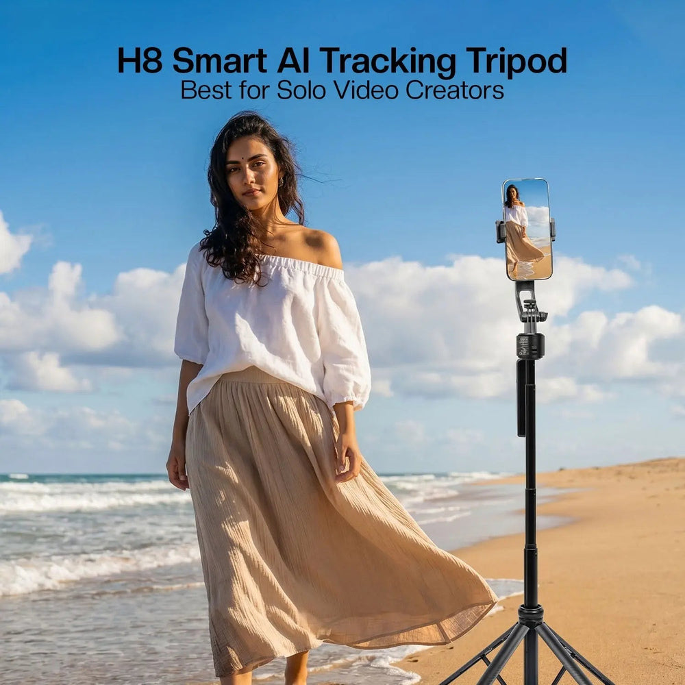 HIFFIN H8 AI face-tracking selfie stick tripod extended at the beach with a smartphone in use
