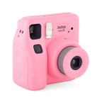 Fujifilm Instax Mini SE pink camera three-quarter view with extended lens and built-in flash