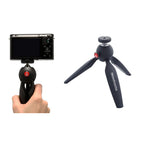 Manfrotto PIXI black mini tripod used as camera handgrip