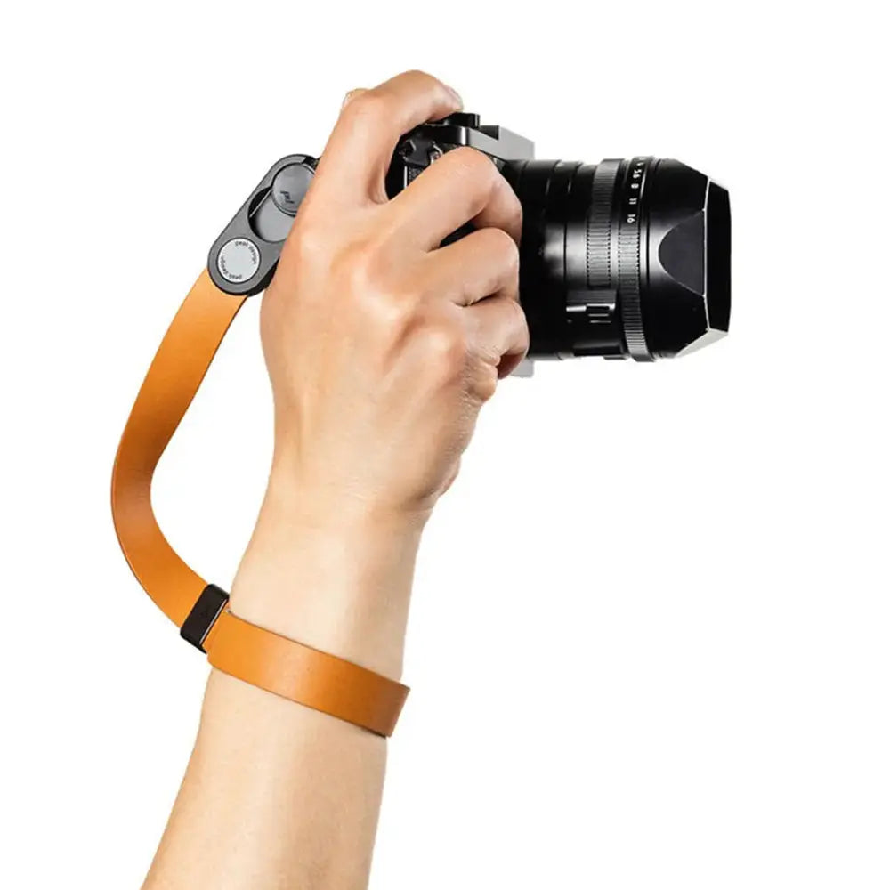 Peak Design Cuff Leather camera wrist strap Amber in use