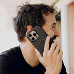 Peak Design Everyday Fabric Case for iPhone 16 Pro Max – Charcoal lifestyle view in use