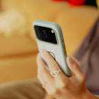 Peak Design Everyday Fabric Case for iPhone 17 Pro Max – Cirrus lifestyle view in hand