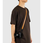 Peak Design Form Leather Camera Neck Strap 30.9" - Amber – Form Leather camera strap Amber worn crossbody