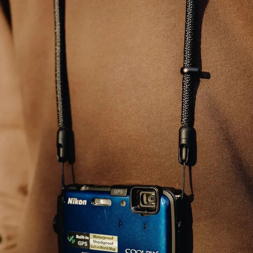 Peak Design Mobile Crossbody Phone Strap attached to compact camera