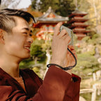 Peak Design Mobile Cuff wrist strap attached to smartphone in use