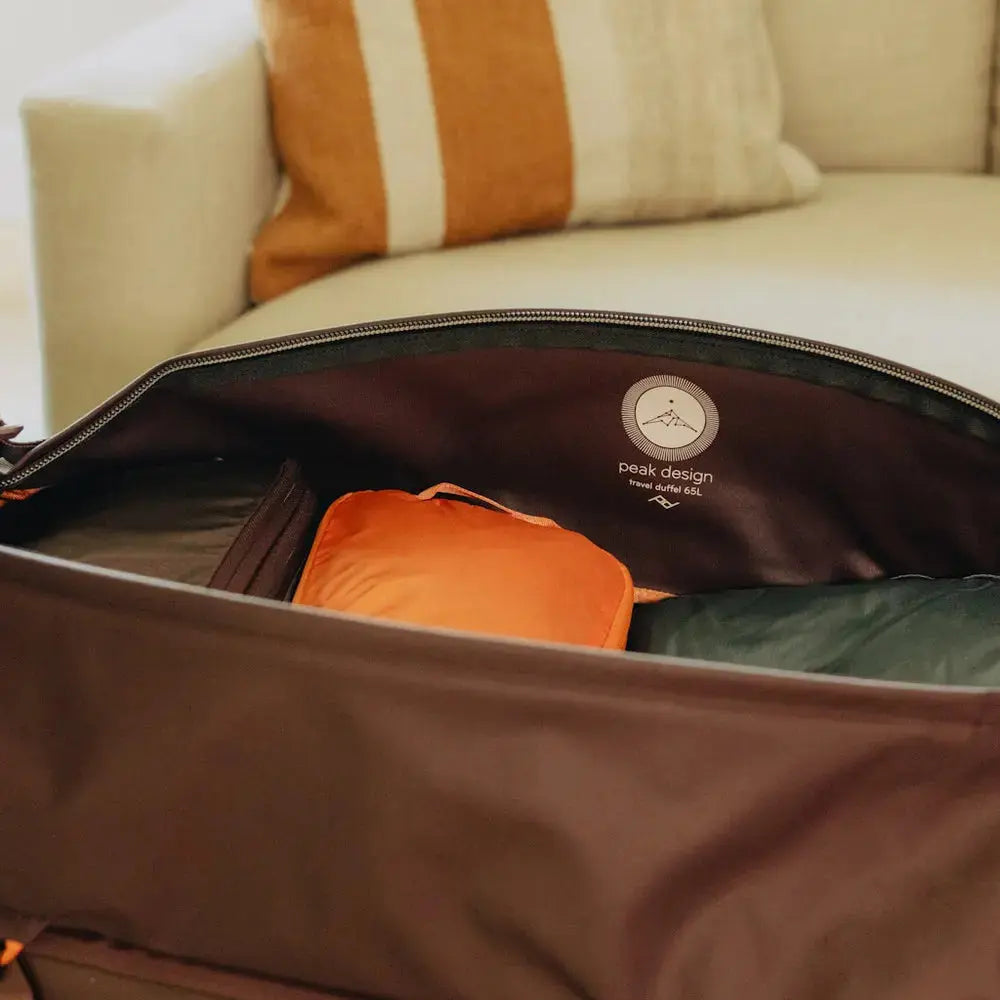 Peak Design Travel Duffel 65L Duffel Bag – Travel Duffel 65L Eclipse packed lifestyle view