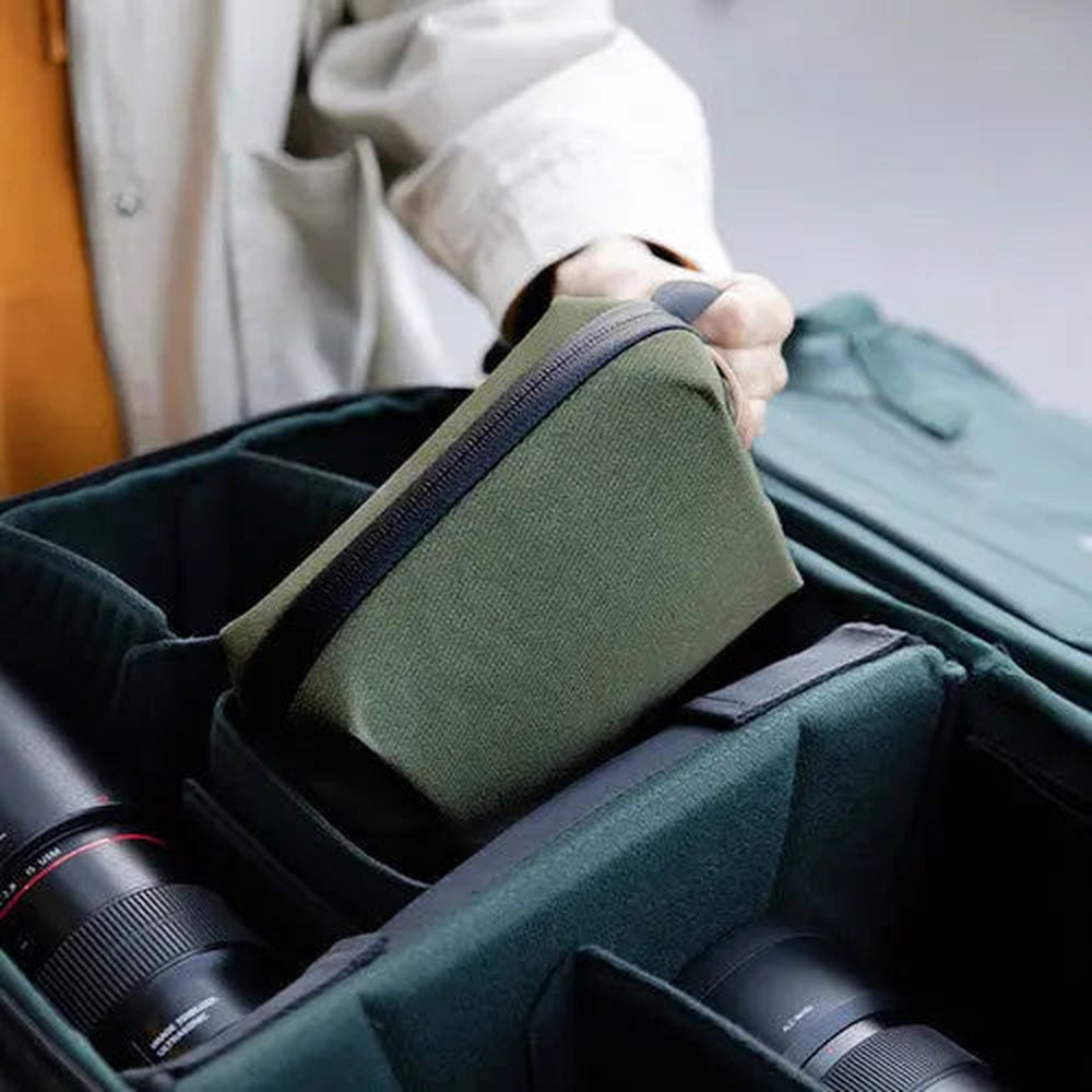PGYTECH Tech Organizer Moss Green P-CB-091 being placed into a camera bag