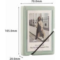 Mint green mini instant film photo album, 28-pocket capacity, elastic band closure, 2x3-inch photos; reference photo—confirm exact stock design before publishing