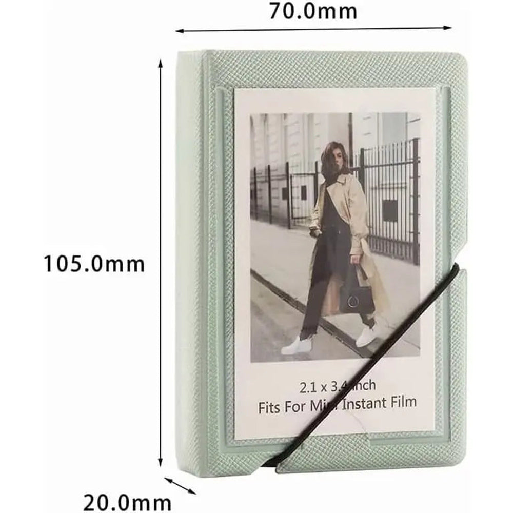 Mint green mini instant film photo album, 28-pocket capacity, elastic band closure, 2x3-inch photos; reference photo—confirm exact stock design before publishing