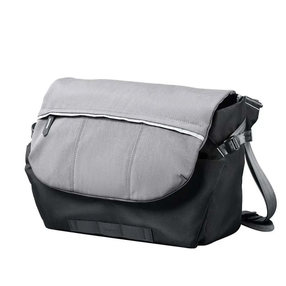 Ulanzi TE88 gray and black 15-liter camera shoulder sling bag front three-quarter view with top flap and adjustable strap on white background.