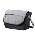Ulanzi TE88 gray and black 15-liter camera shoulder sling bag front three-quarter view with top flap and adjustable strap on white background.