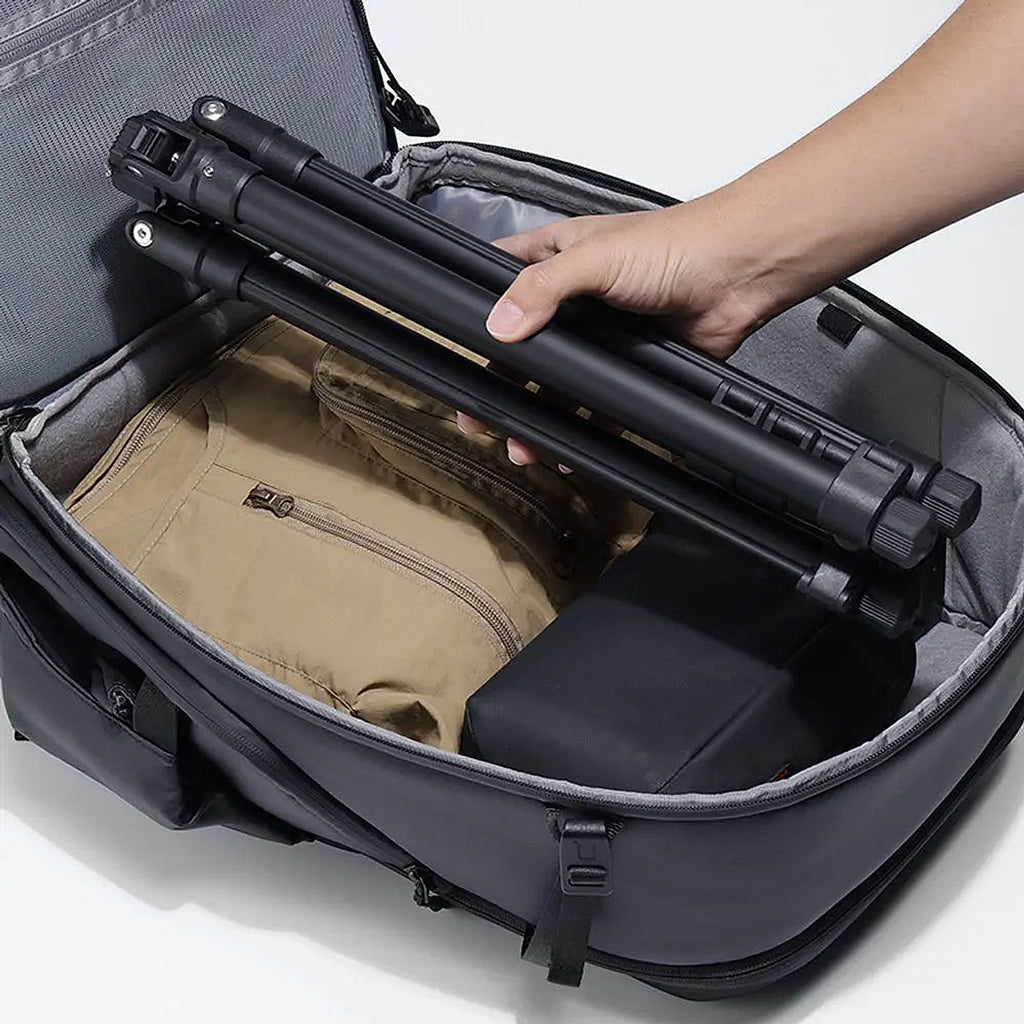 Ulanzi TT43 II reverse-folding light stand collapsed compactly and packed into camera bag, supplementary travel view