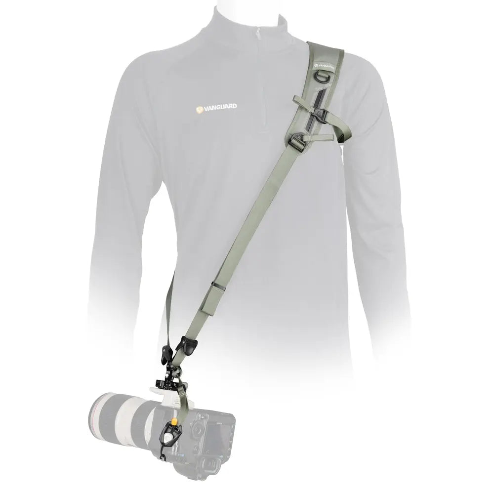 Vanguard PRO STRAP GR olive-green camera shoulder sling worn crossbody on mannequin, showing padded strap and mounted camera against white.