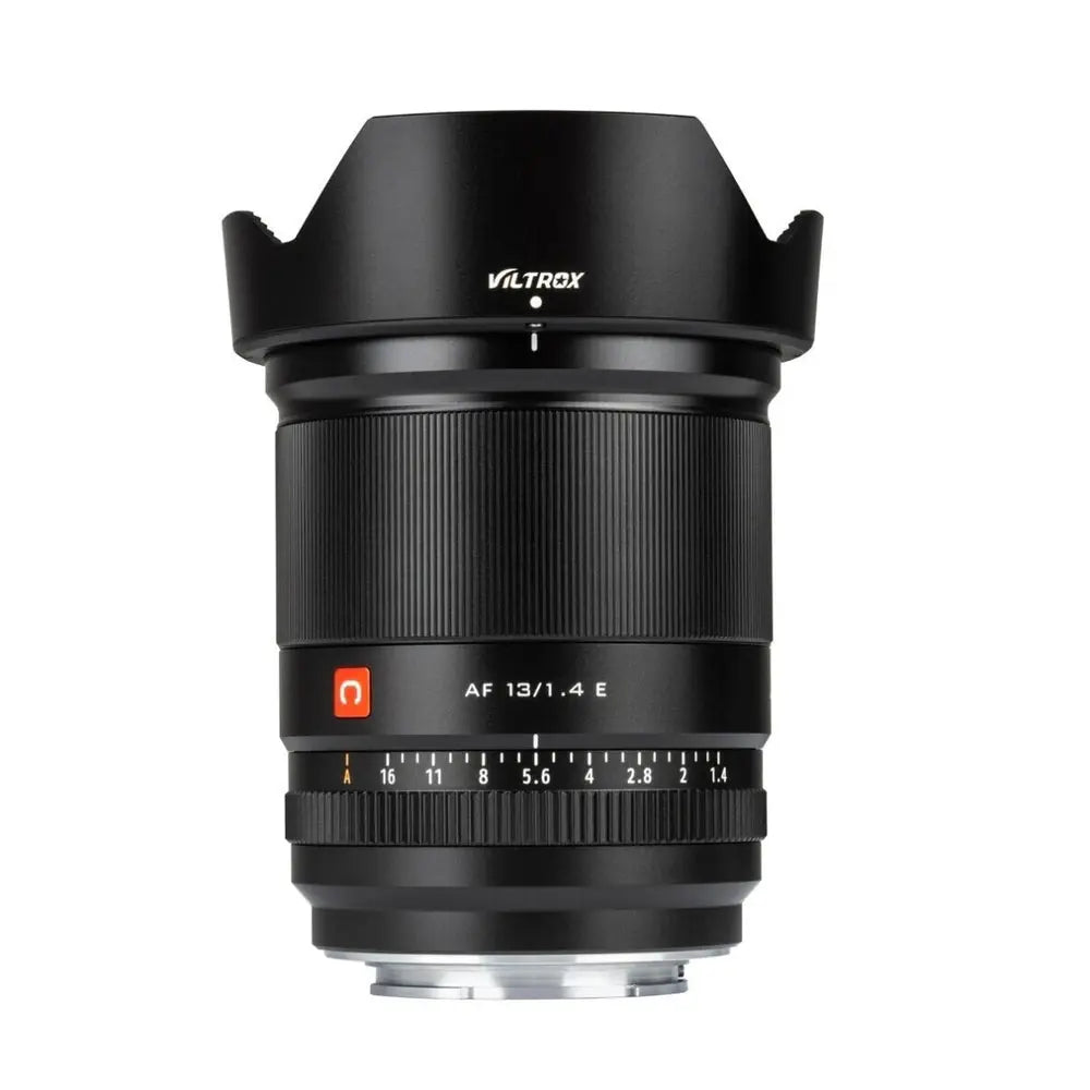 Viltrox AF 13mm f/1.4 Sony E-mount APS-C ultra-wide-angle lens, upright with petal hood and red logo on white background.